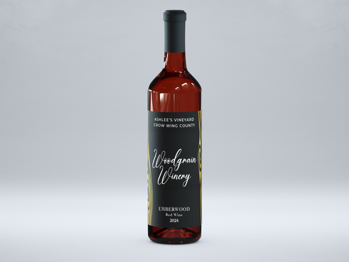 This is a picture of woodgrain winerys red wine named Emberwood. The bottle is standing vertically and has a black lable with gold metal flake woodgrain. The words on the lable are white. The image views the bottle from the front